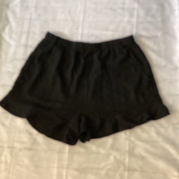 Black Ruffle Hem Shorts - Picture 1 of 3